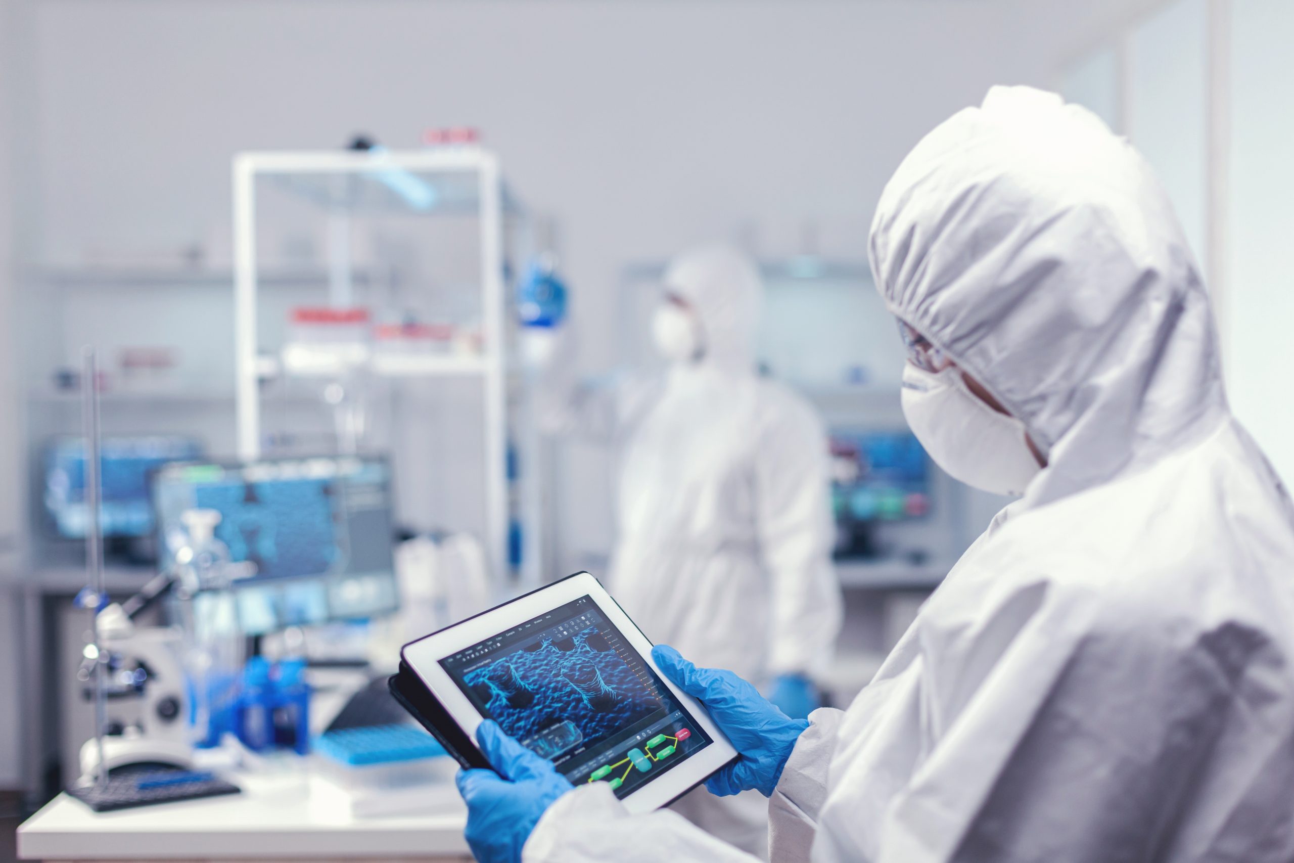 Concentrated medical researcher using digital tablet